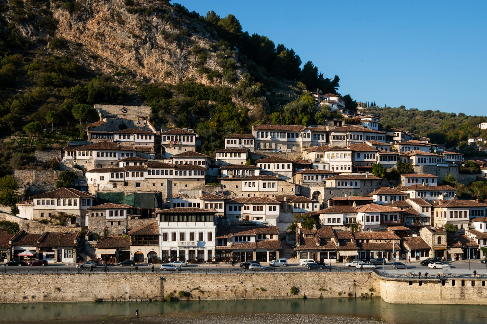 The white Ottoman houses of Berat, the city of a thousand windows, stacked up the hillside