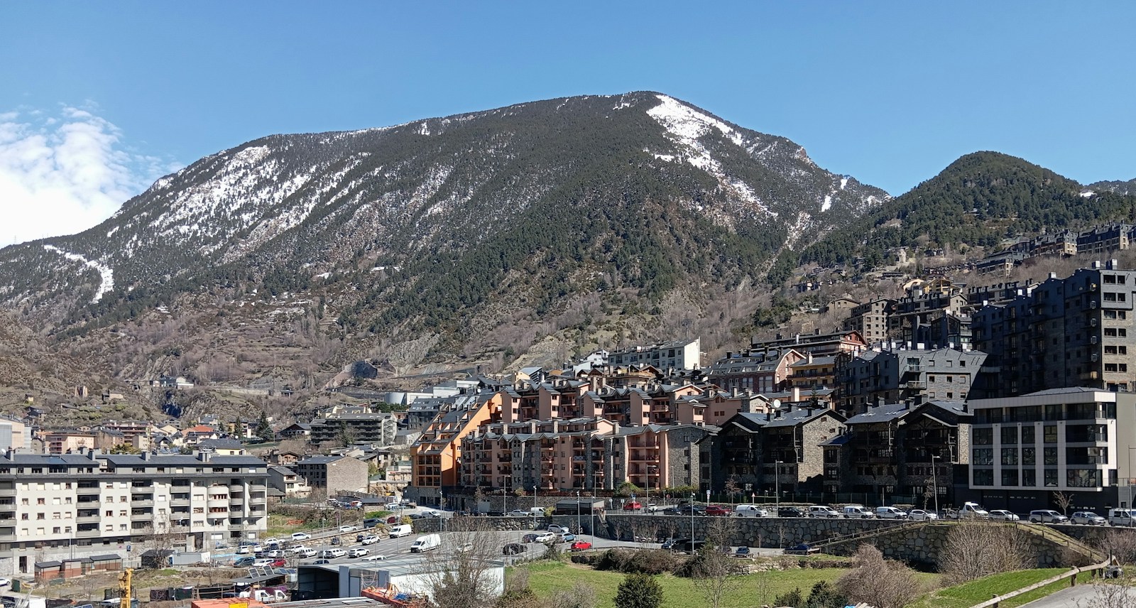 Andorra la Vella in its valley below snow-dusted Pyrenees peaks, Andorra