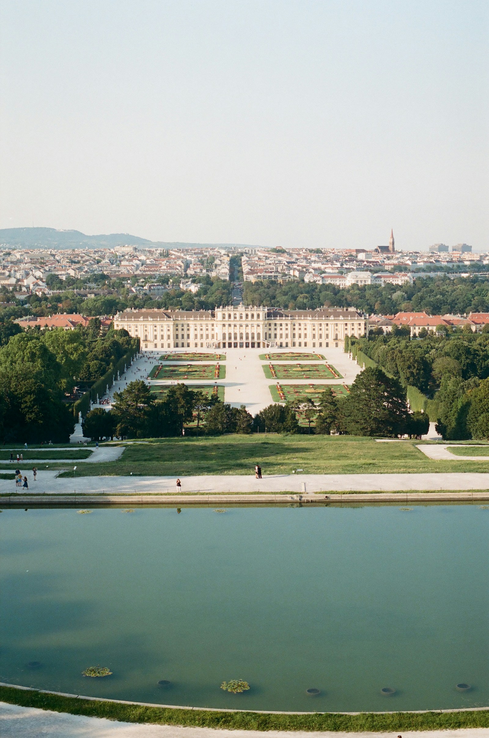 Schonbrunn Palace and its formal gardens with the Vienna skyline behind