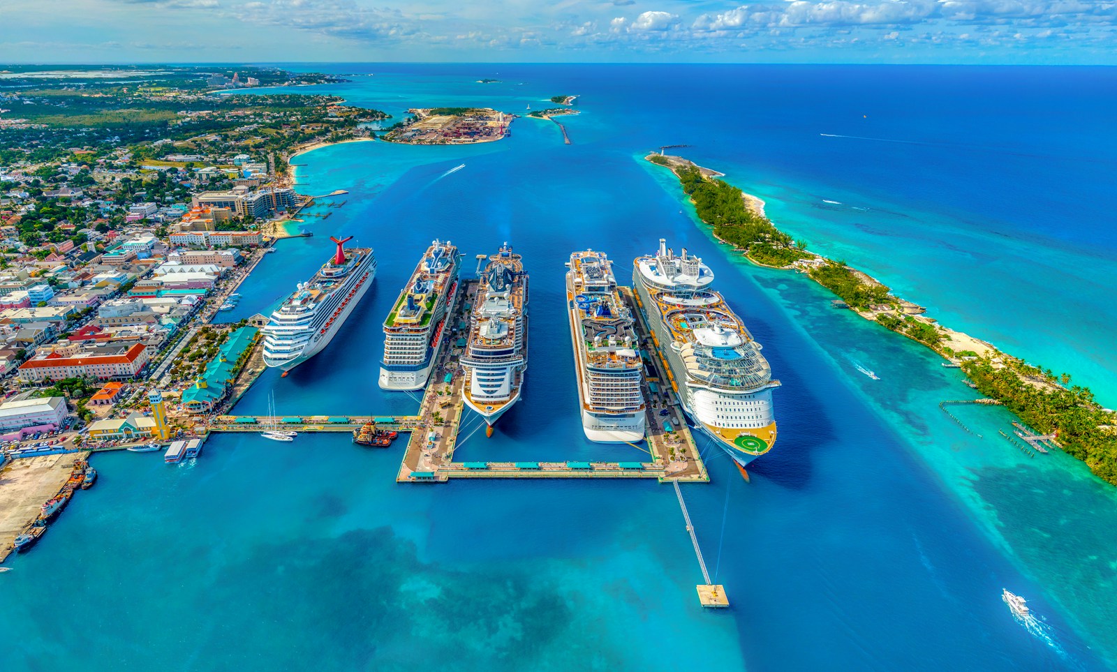 An aerial view of cruise ships docked at Nassau harbour beside the colourful town, Bahamas