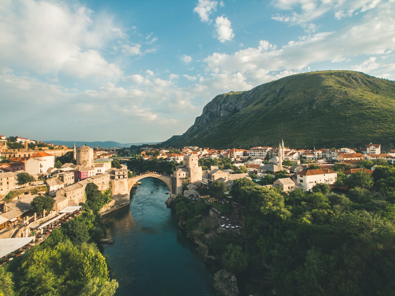 The arched Old Bridge over the emerald Neretva in the old town of Mostar
