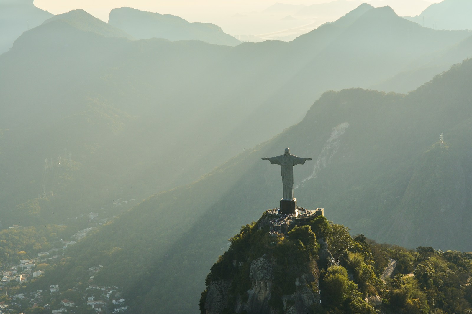 Christ the Redeemer above the misty mountains and city of Rio de Janeiro