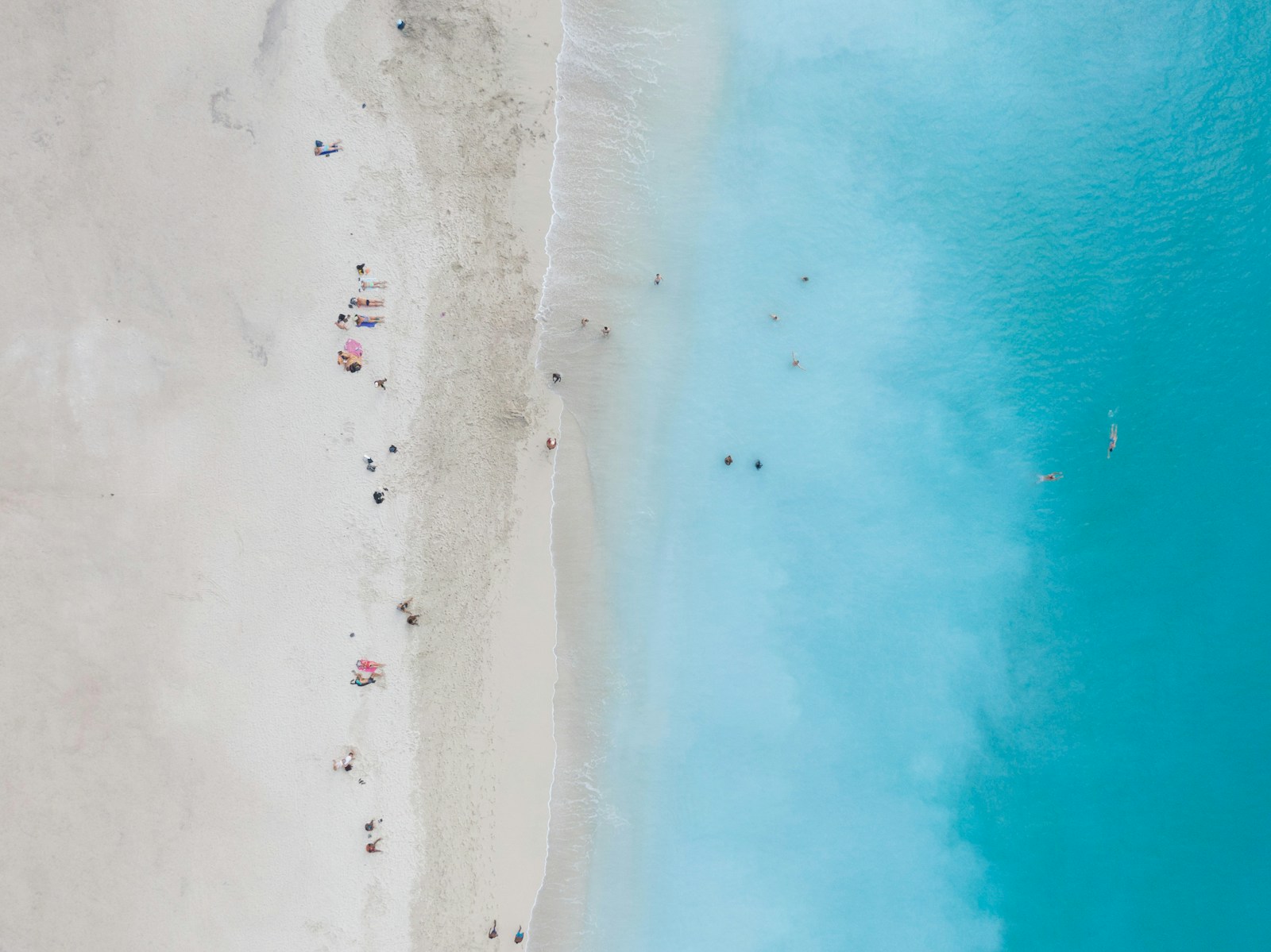 An aerial view of a white-sand beach and turquoise water on the island of Sal, Cape Verde