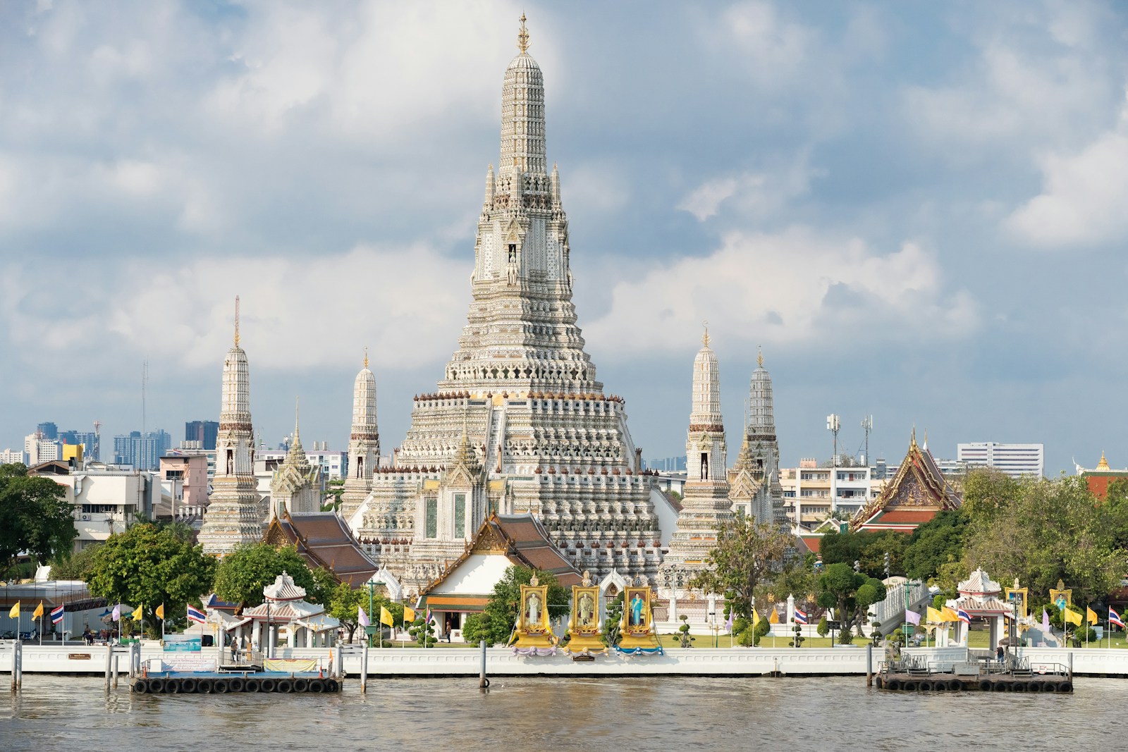 The Wat Arun temple and its central prang on the Chao Phraya river in Bangkok