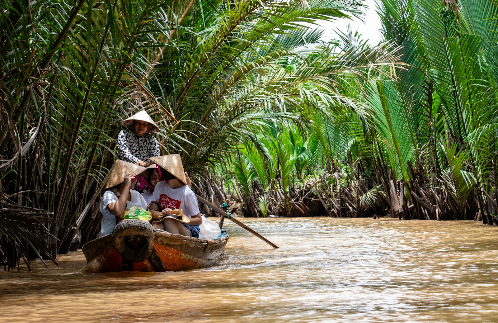 People on boats in the Mekong River Delta near Ho Chi Minh City, Vietnam
