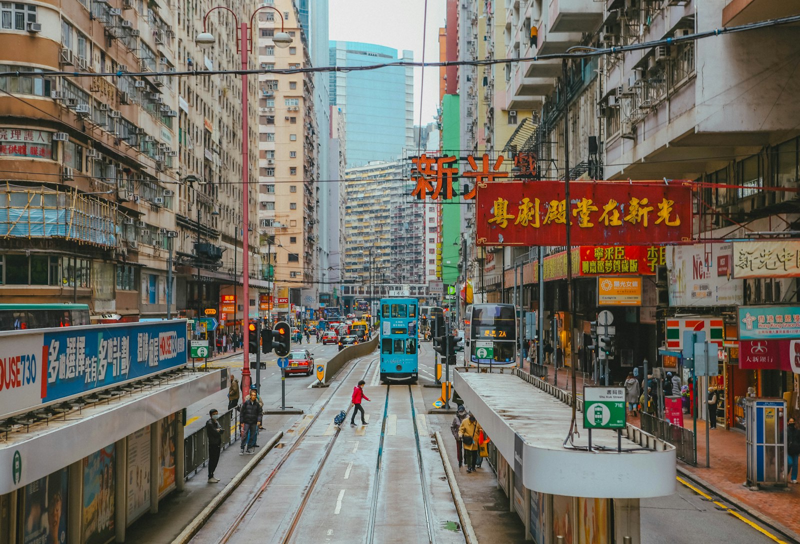 A dense street of tall buildings in Hong Kong