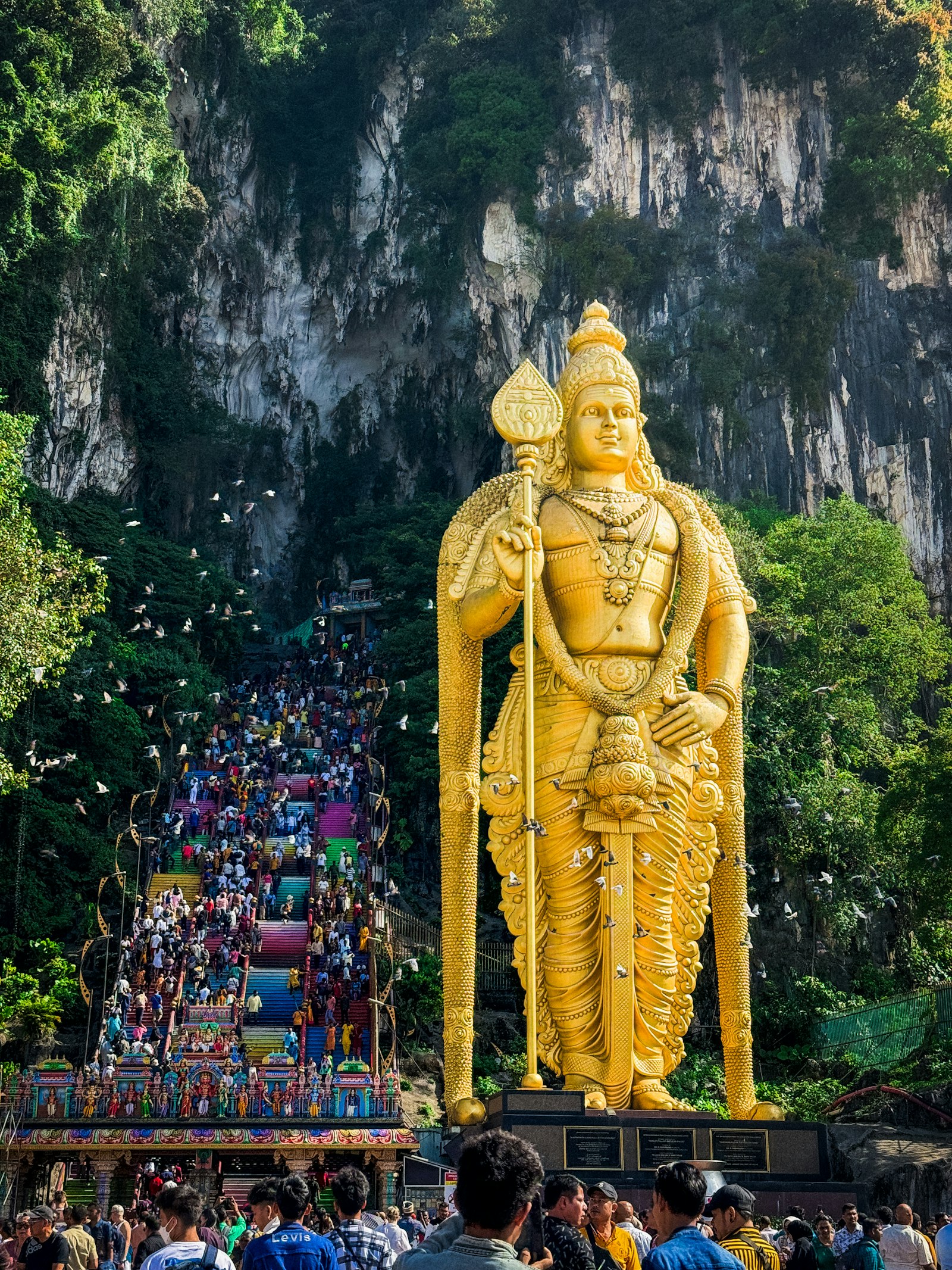 The golden Murugan statue and rainbow steps at Batu Caves near Kuala Lumpur, Malaysia