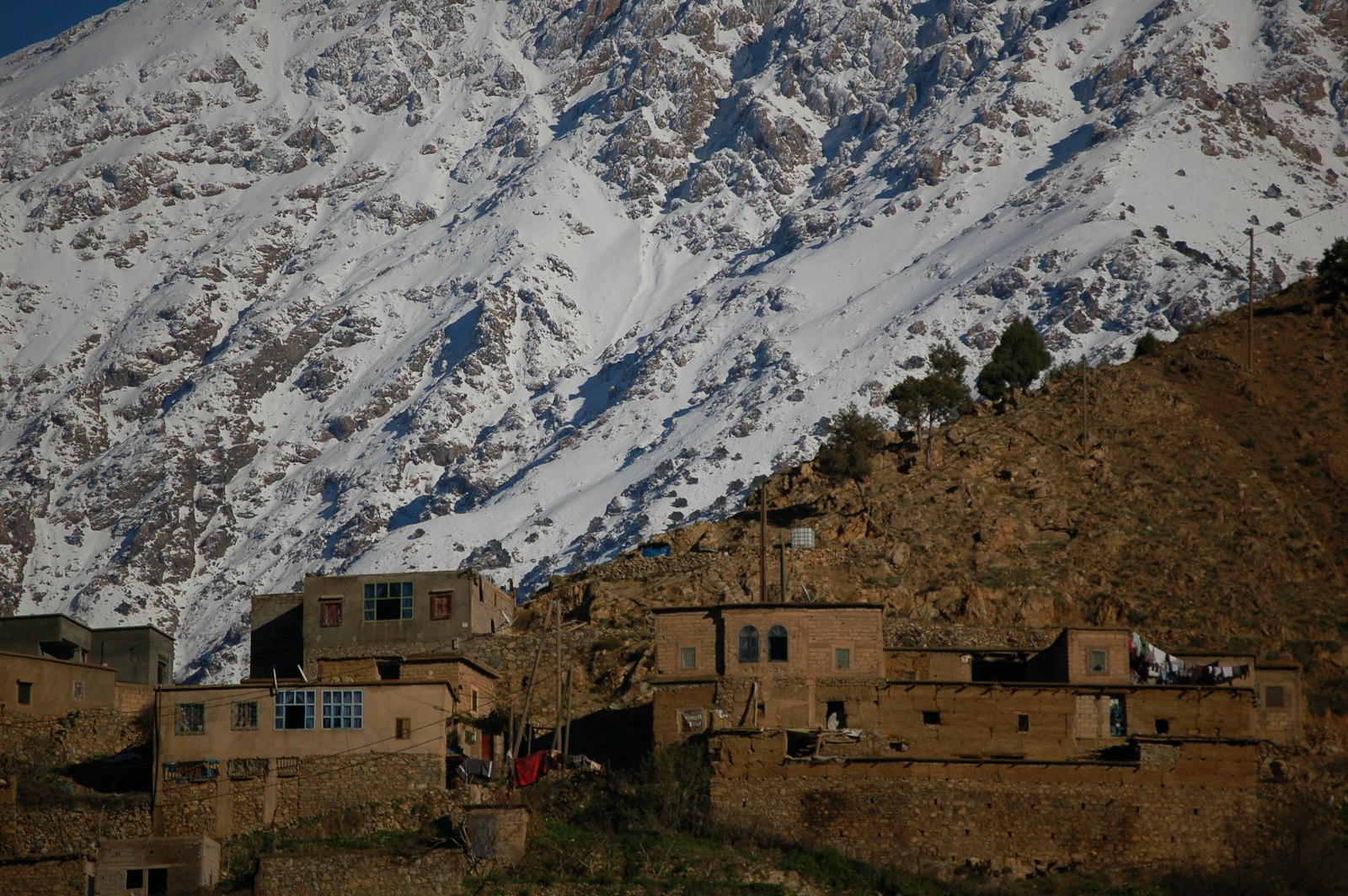 A Berber village below the snow-capped High Atlas Mountains in Morocco