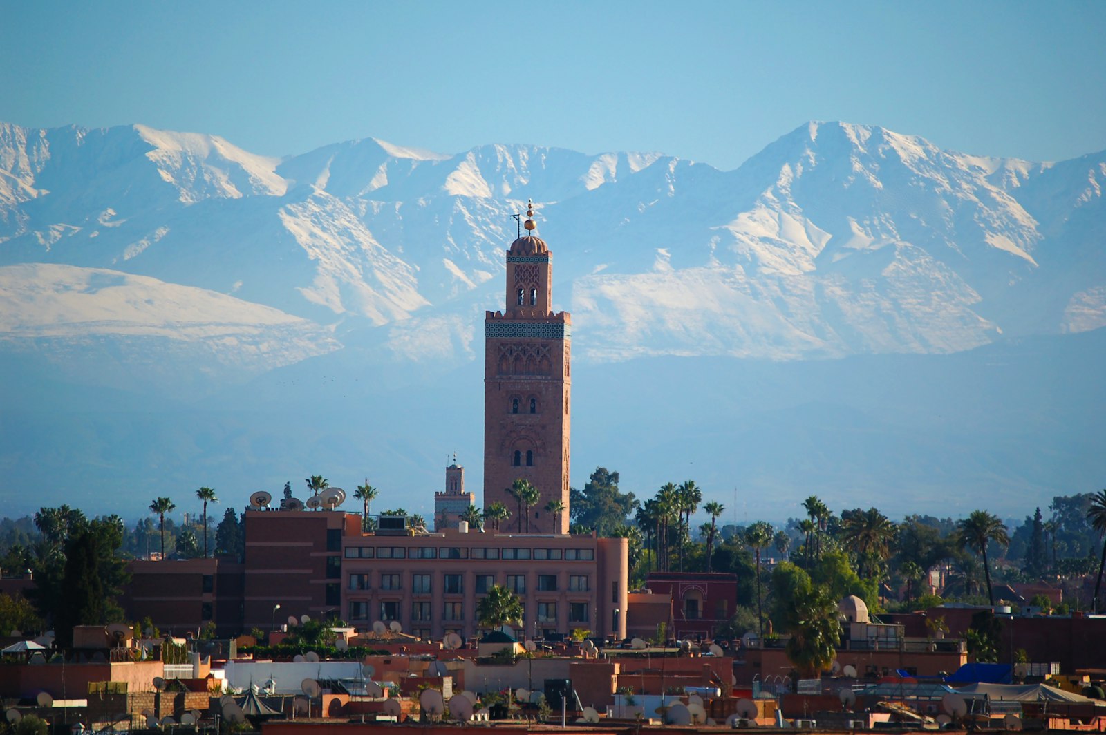 The Koutoubia Mosque minaret in Marrakech with the Atlas Mountains behind