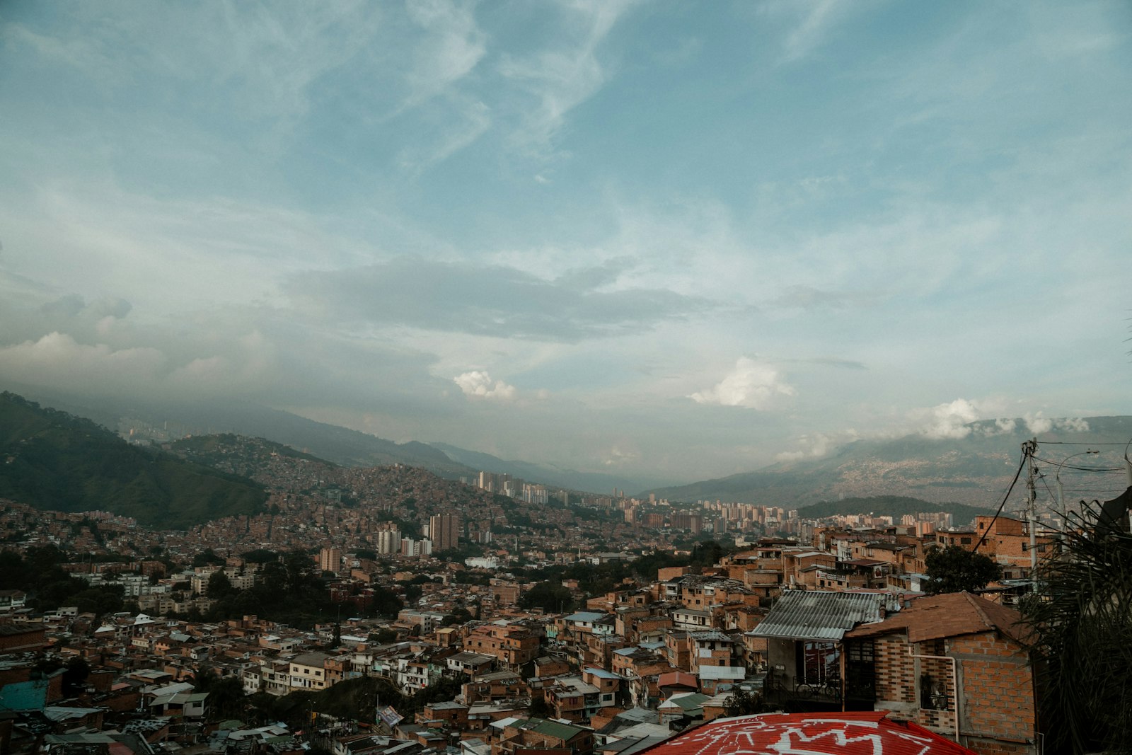 The city of Medellin filling its valley beneath green mountains
