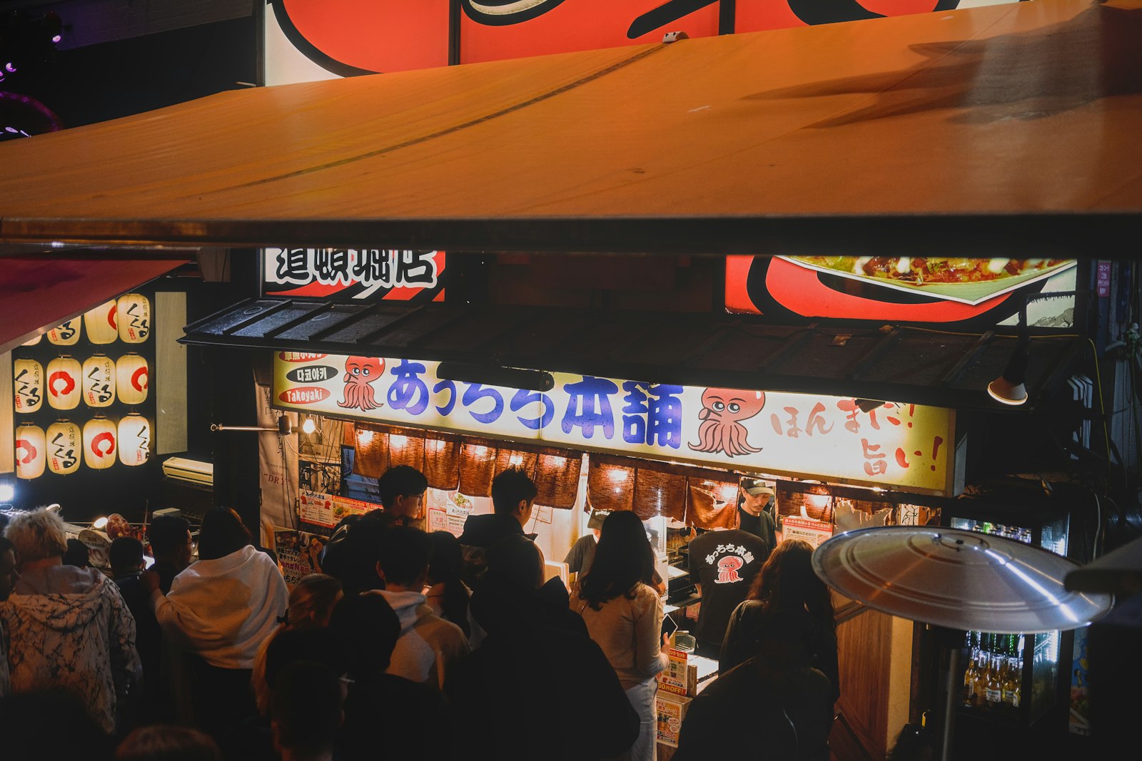 A street food scene in Osaka at night