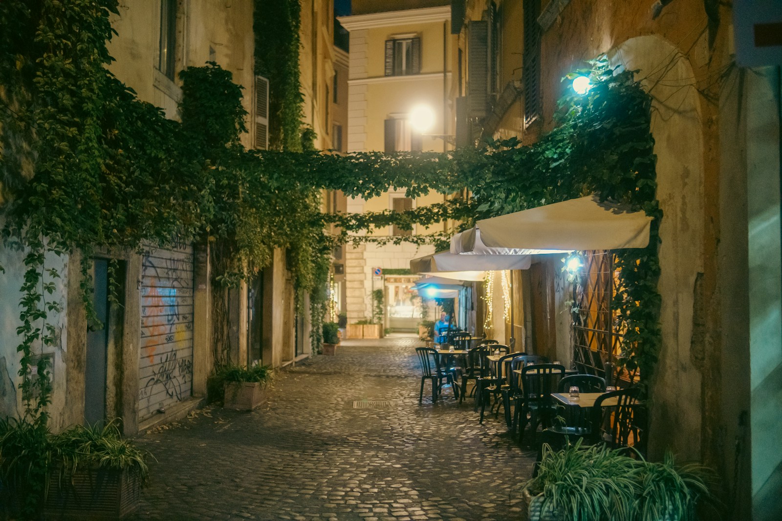A cobblestone dining street in Trastevere, Rome
