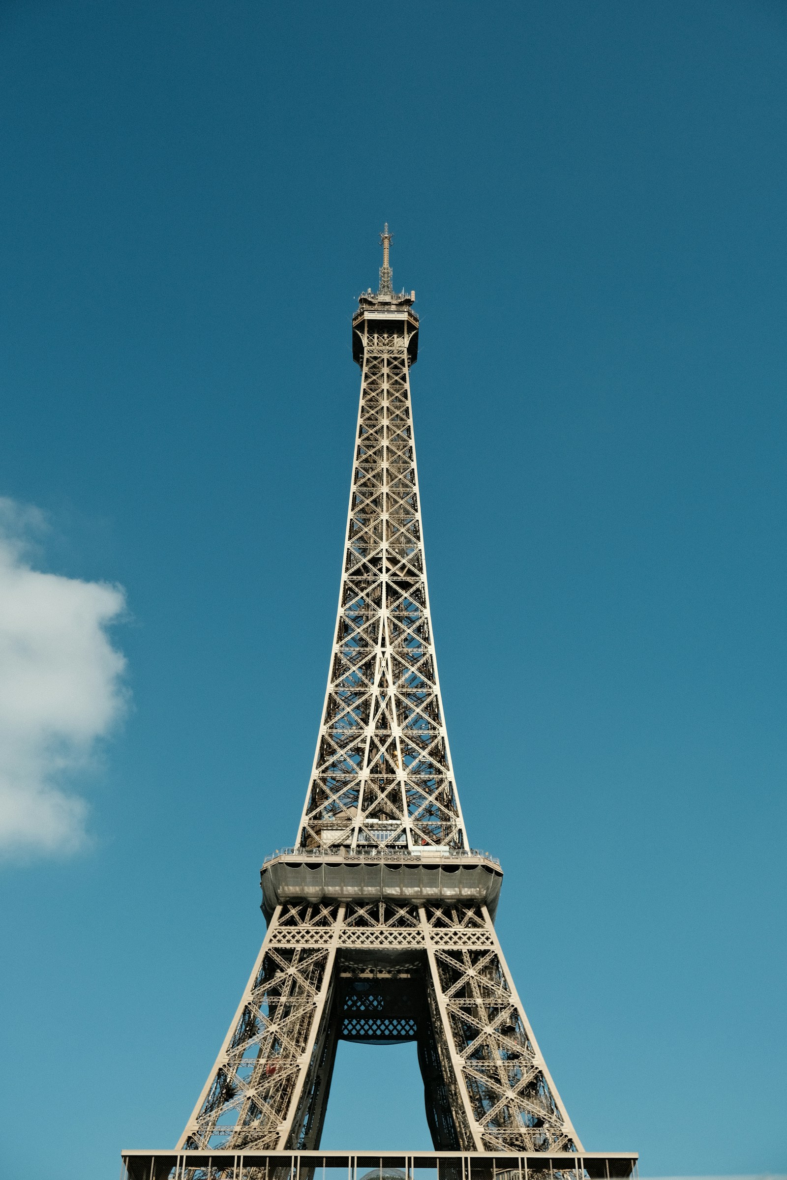 The Eiffel Tower against a clear blue Paris sky