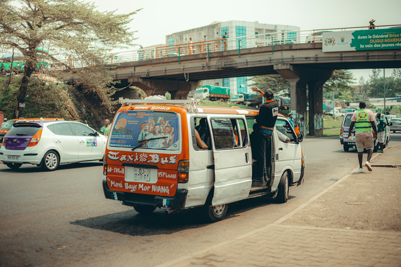 A taxi bus on a busy road in Libreville, Gabon