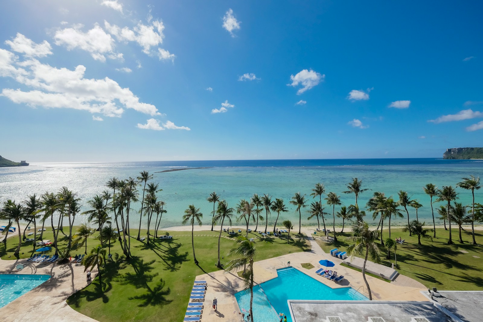 The turquoise lagoon and palm-lined resort shore of Tumon Bay, Guam