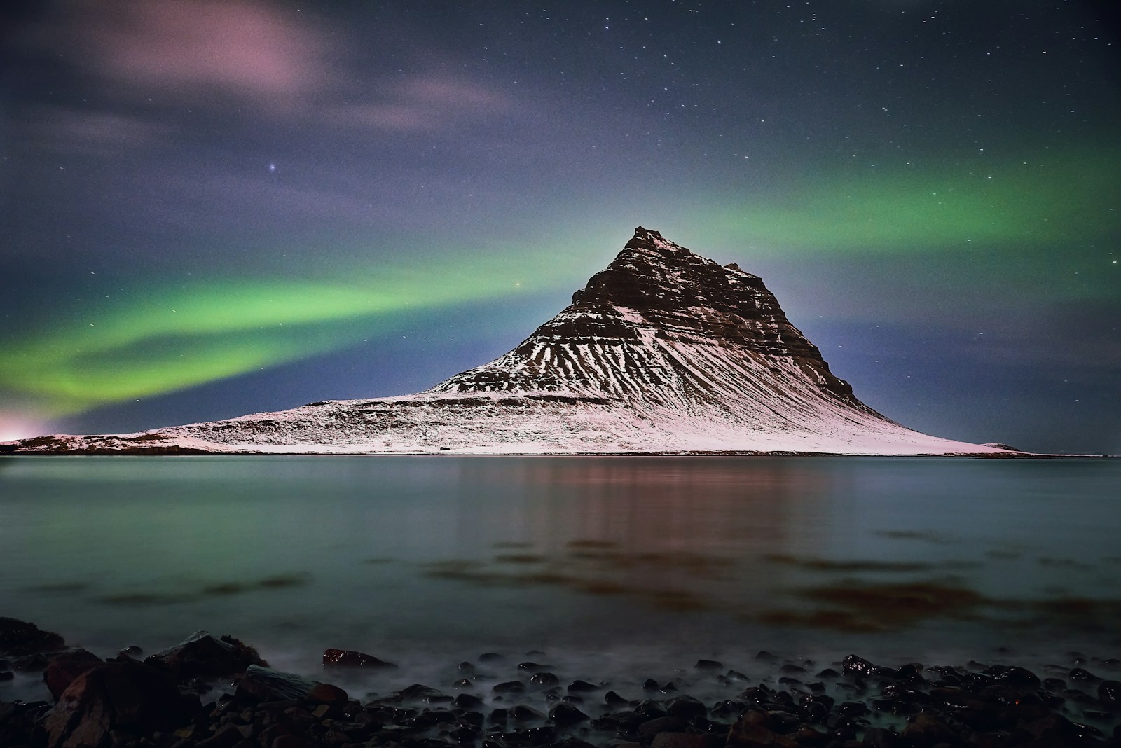 The Northern Lights over the Kirkjufell mountain in Iceland