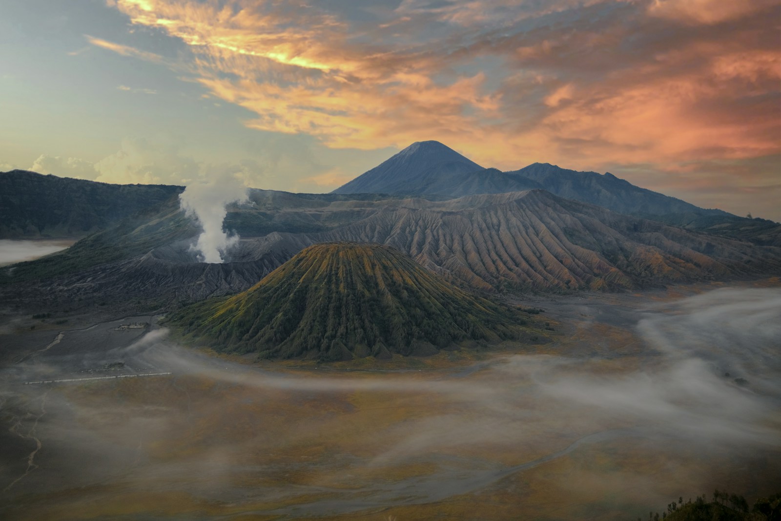 The smoking caldera of Mount Bromo at sunrise in East Java