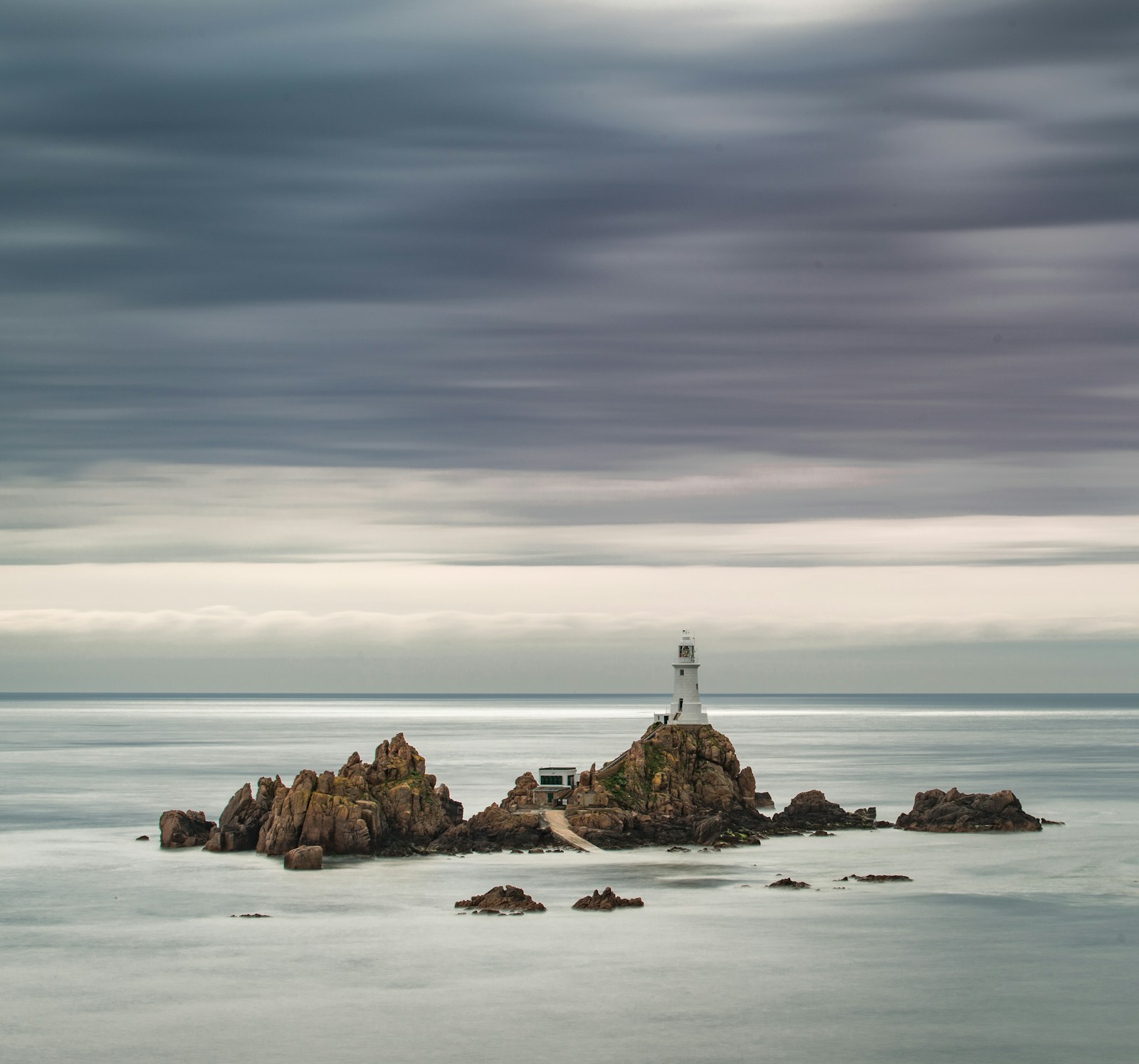 A long-exposure seascape of Corbiere Lighthouse, St Brelade, Jersey