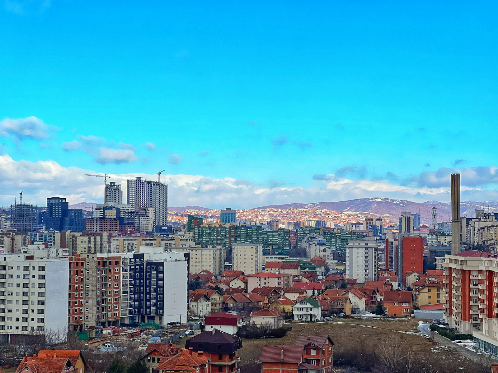 The skyline of the capital Pristina with mountains behind, Kosovo