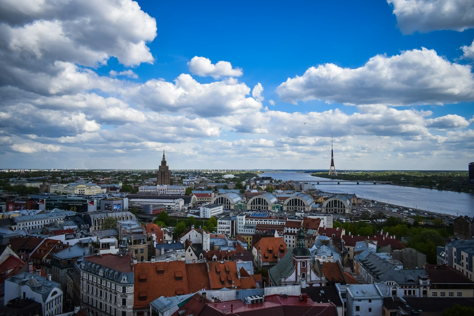 The red-roofed old town of Riga with the Central Market and the Daugava river beyond