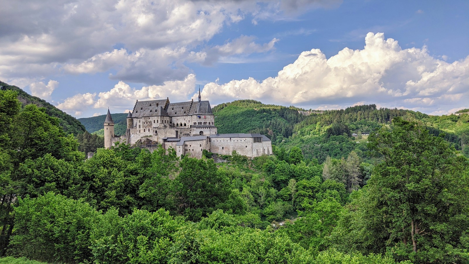 The medieval Vianden castle on its forested hilltop in Luxembourg