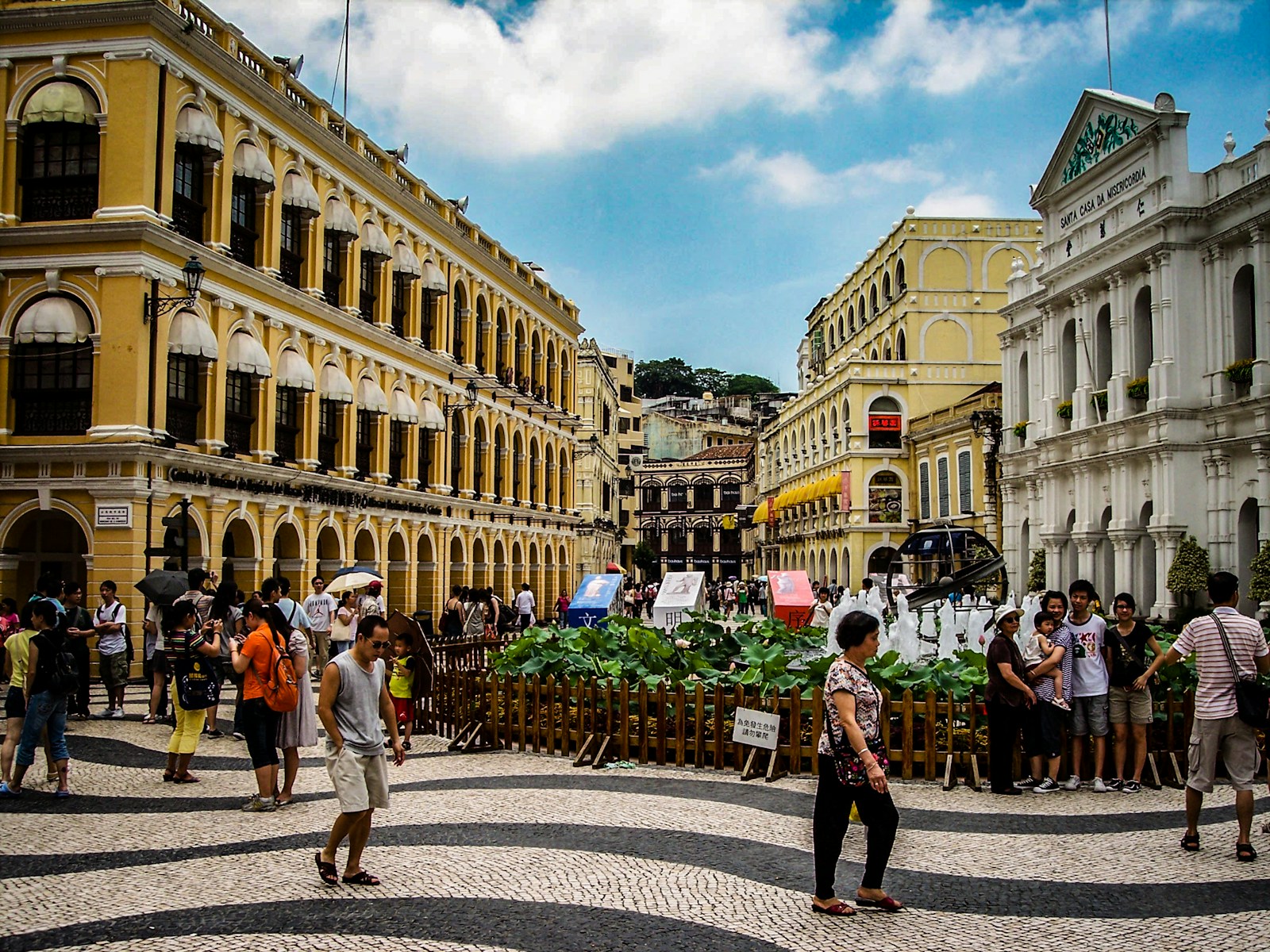 Senado Square with its wave-patterned Portuguese cobblestones and pastel colonial buildings, Macau