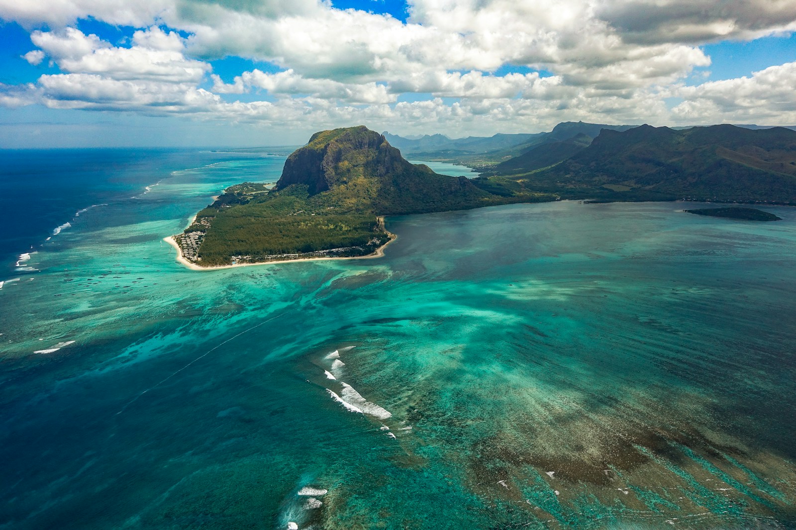 An aerial view of Le Morne Brabant and the turquoise lagoon with its underwater-waterfall illusion, Mauritius