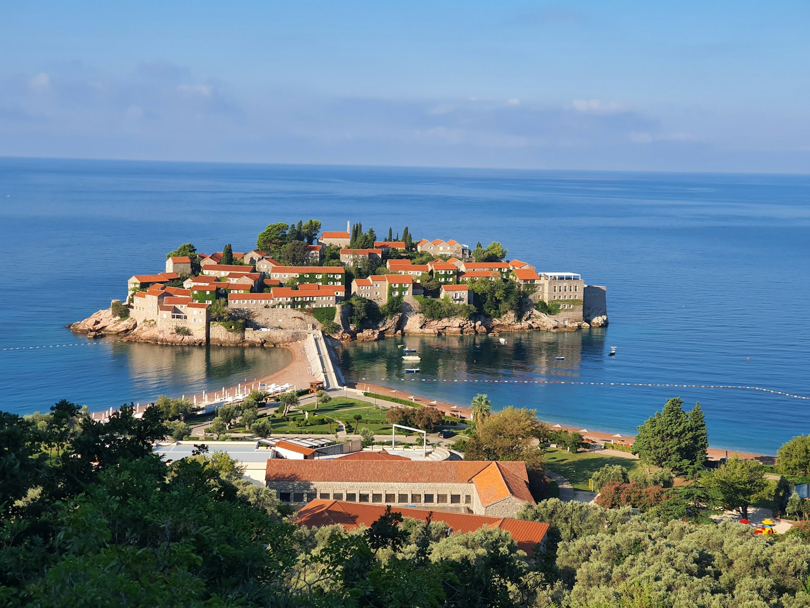 The fortified islet of Sveti Stefan connected to the Montenegrin coast by a causeway