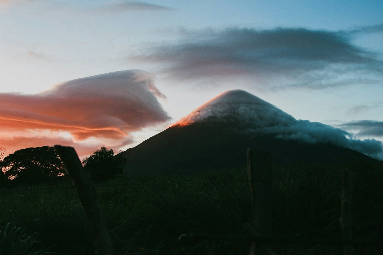 Concepcion volcano wrapped in lenticular clouds at sunset over Ometepe island, Nicaragua