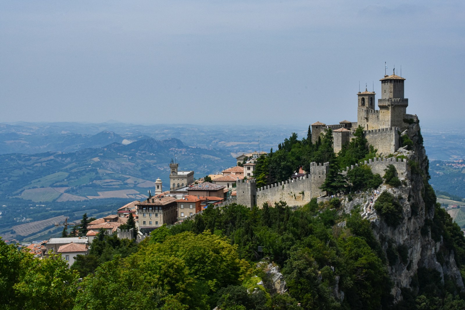 The Guaita tower above the old town of San Marino with the plain and the Adriatic beyond