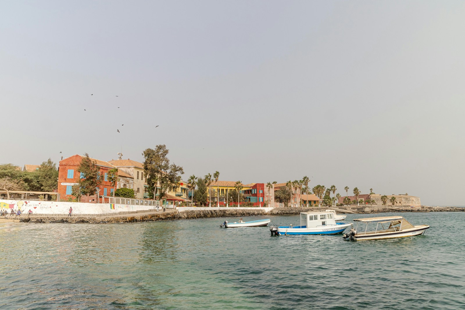 The colourful colonial waterfront and boats of Goree Island off Dakar, Senegal