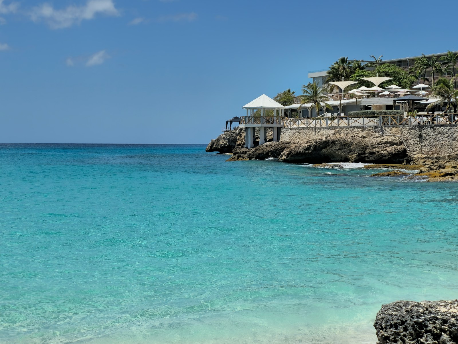 A turquoise cove with a cliffside resort, Sint Maarten