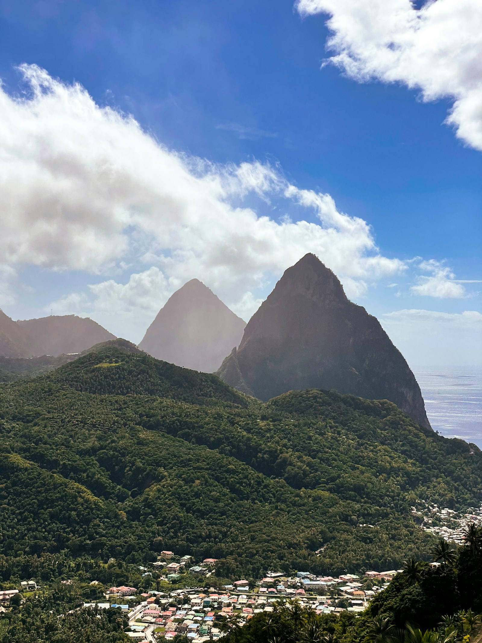 The twin Pitons towering over the town of Soufriere and the sea, St Lucia