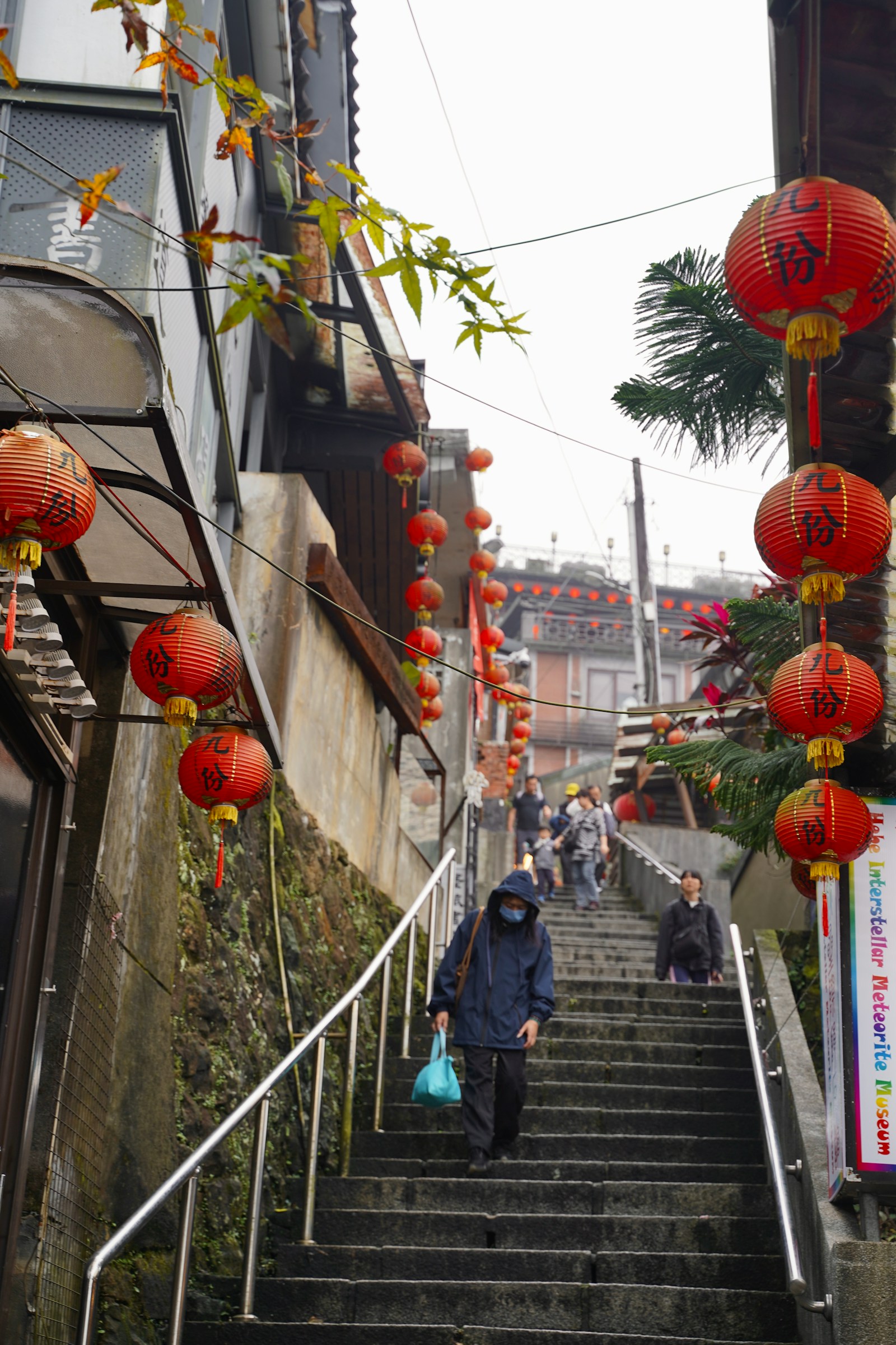 Red lanterns marked Jiufen hanging over the stepped old-street alley in Jiufen, Taiwan