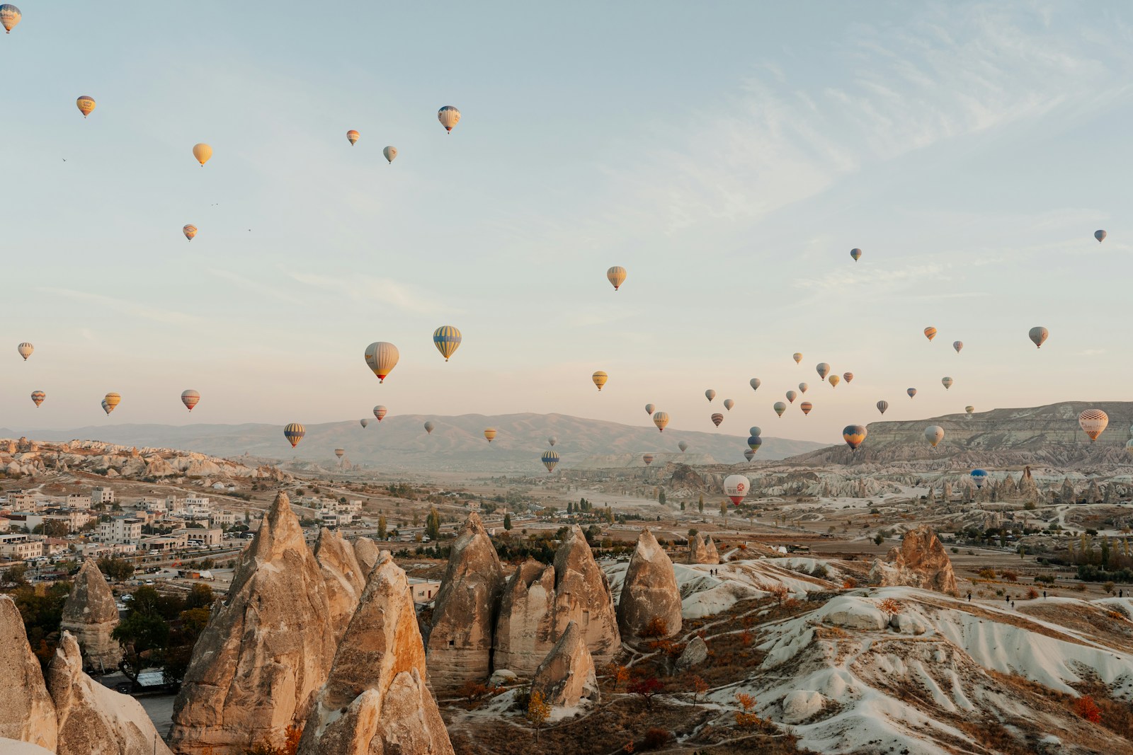 Hot-air balloons at sunrise over the fairy chimneys of Cappadocia