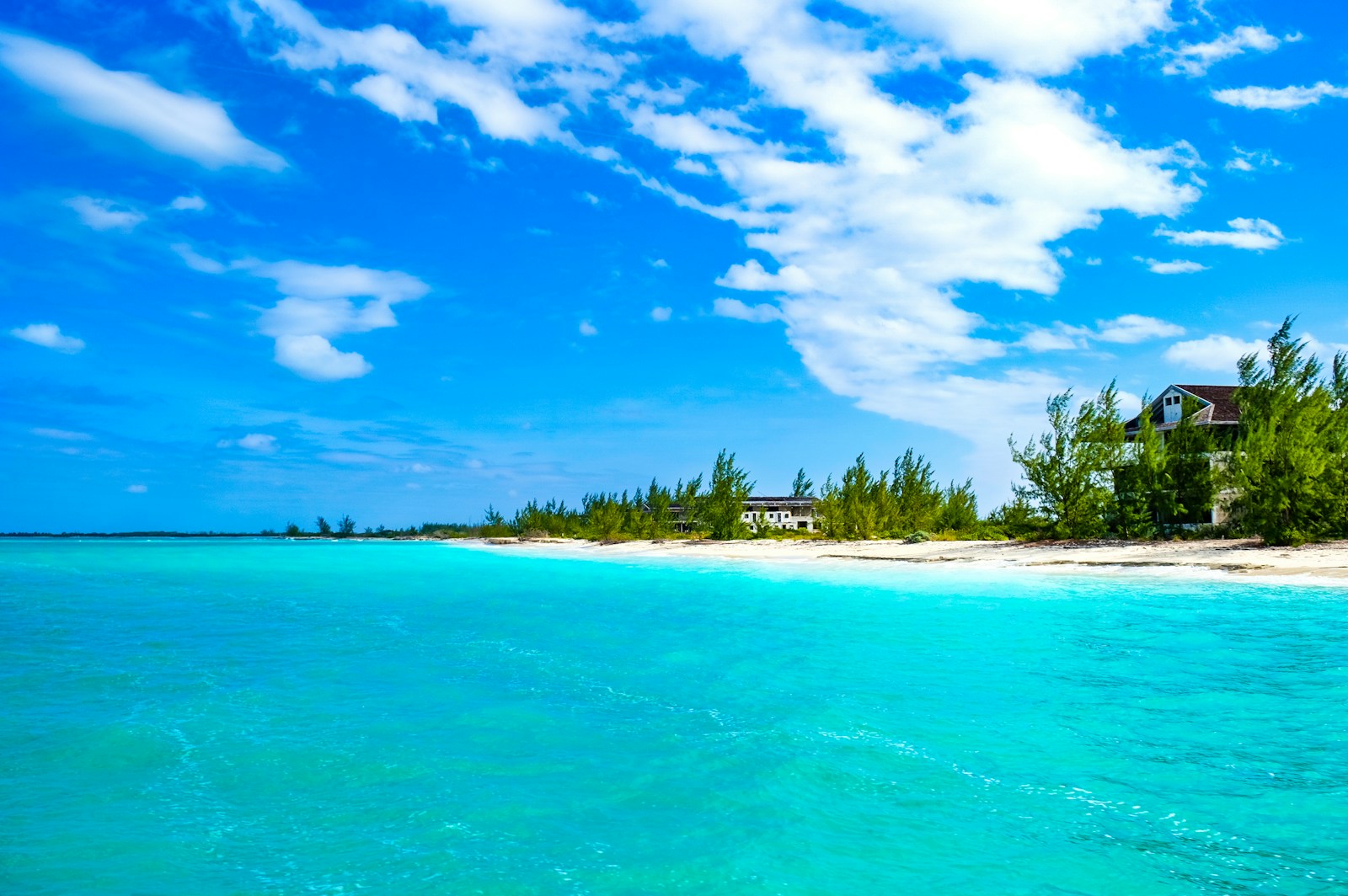 A turquoise beach and white sand seen from the water, Turks and Caicos
