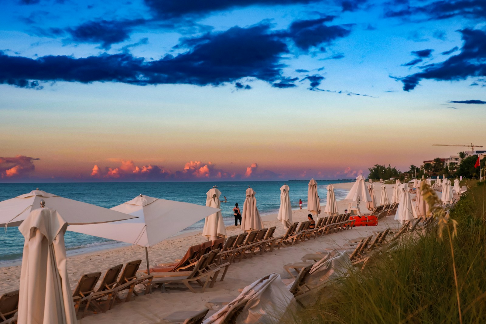 Rows of loungers and umbrellas on Grace Bay at golden hour, Turks and Caicos
