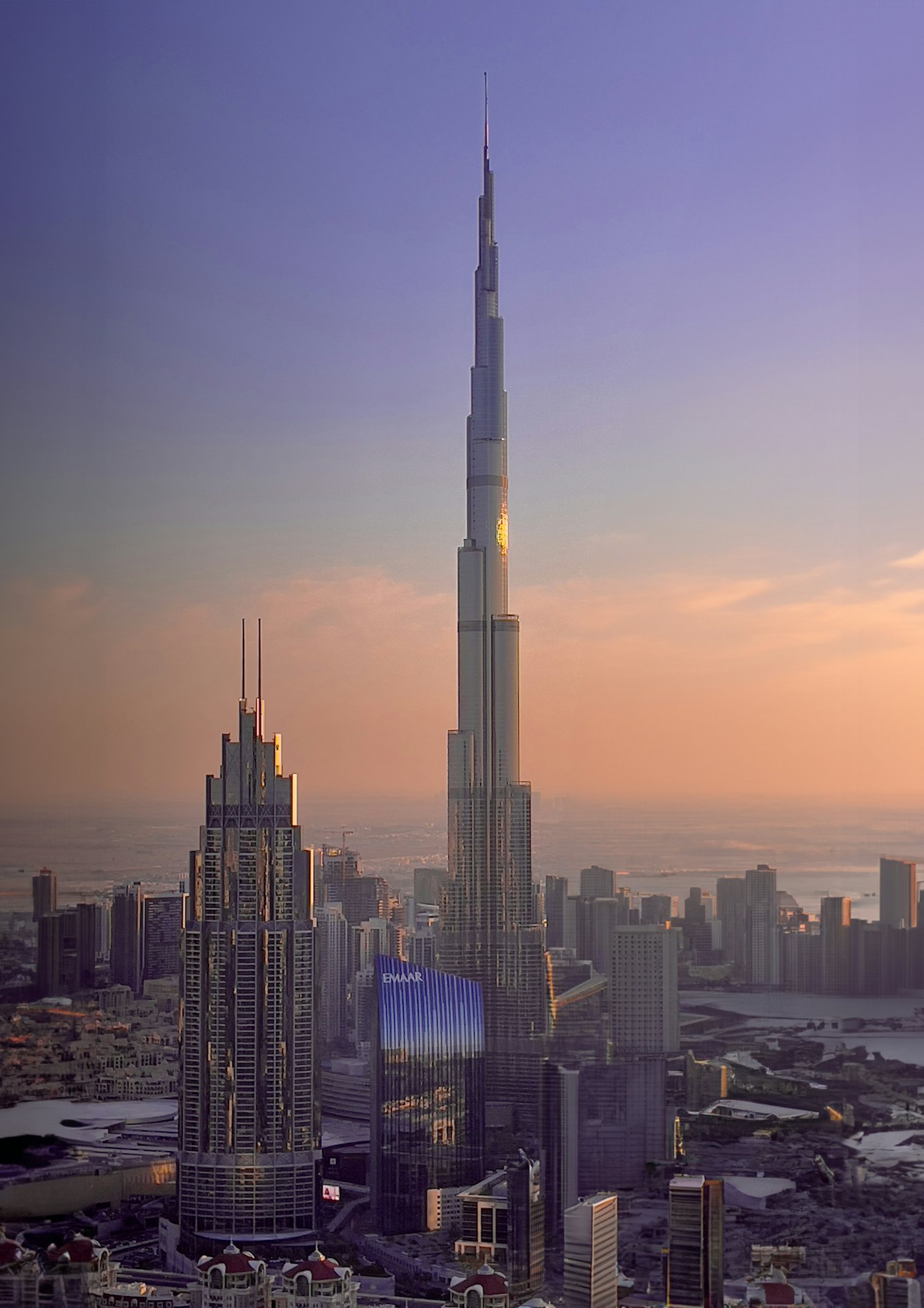 The Burj Khalifa towering over the Dubai skyline at sunset